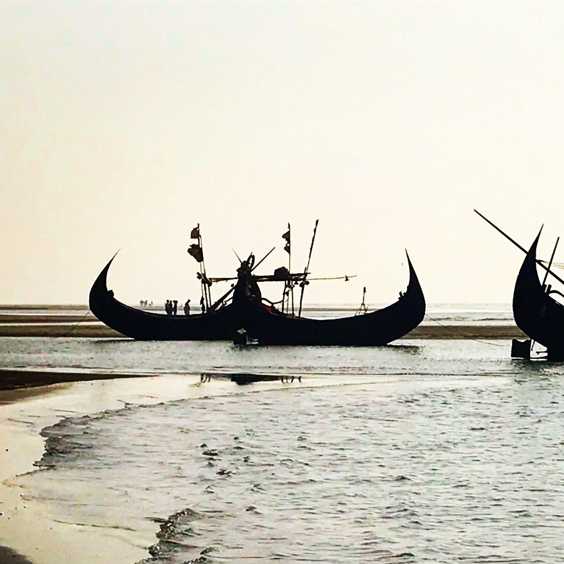 Traditional asian ships stranded on the beach.