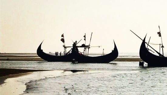 Traditional asian ships stranded on the beach.