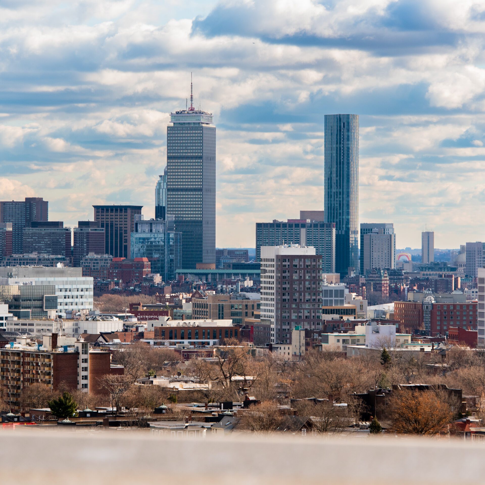 A Boston city skyline featuring the John Hancock Tower and the Prudential Tower.