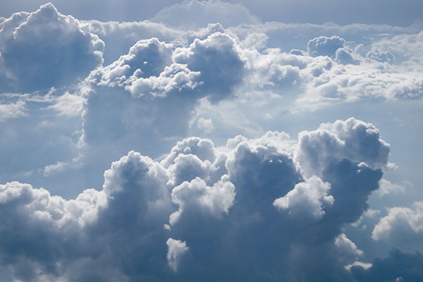 Aerial view of a bank of blueish nimbus clouds.