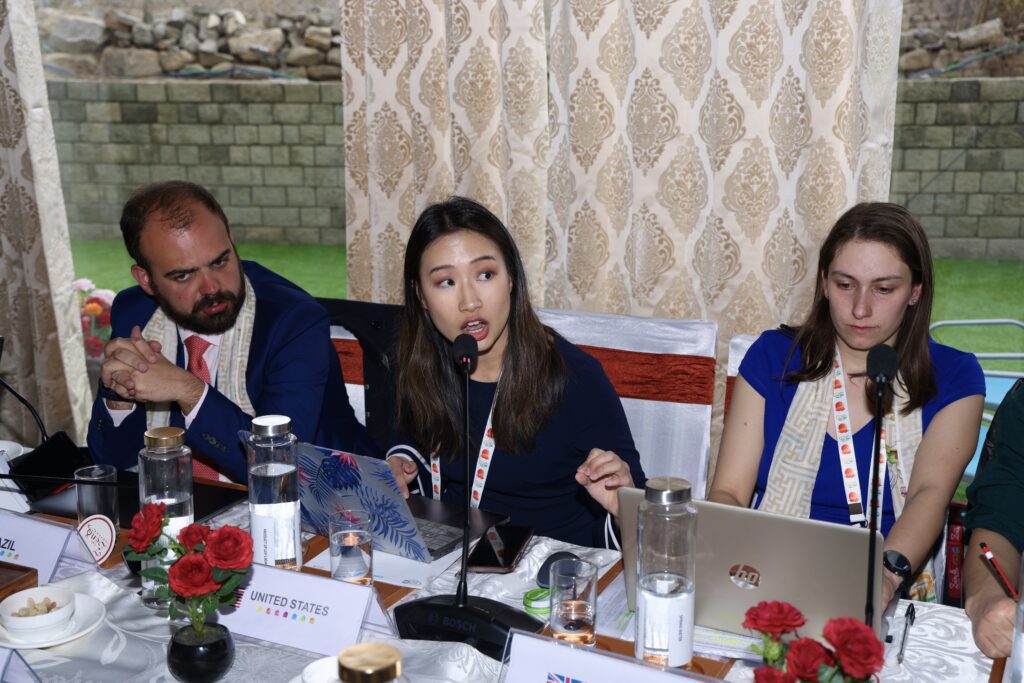 Cynthia Yue (center) participates in climate policy negotiations as part of the 2023 G20 Youth 20 Summit.