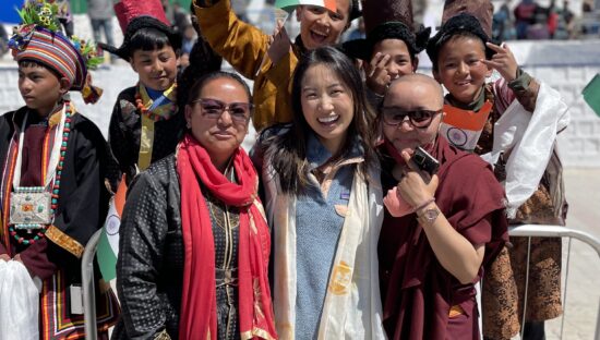 Harvard Climate Internship fellow Cynthia Yue (center) meets local youth in Leh while visiting India for 2023 G20 Youth 20 Summit negotiations.