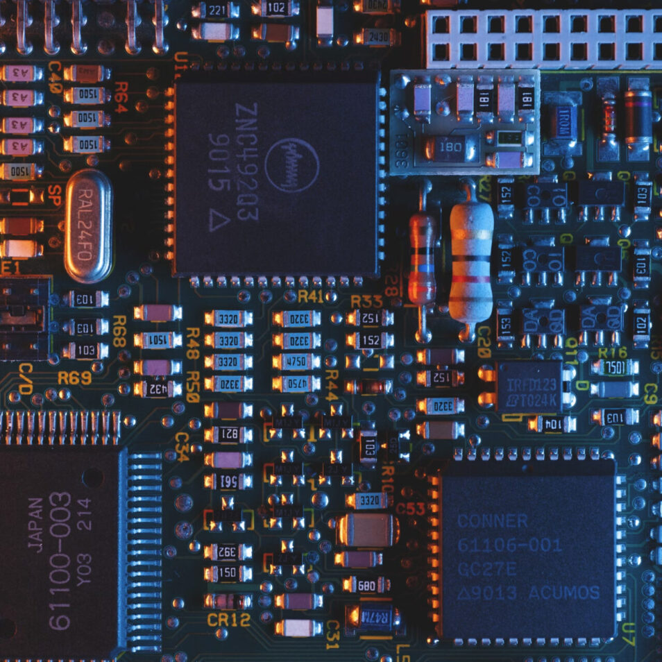 Close up shot of a computer chip cast in red and blue light