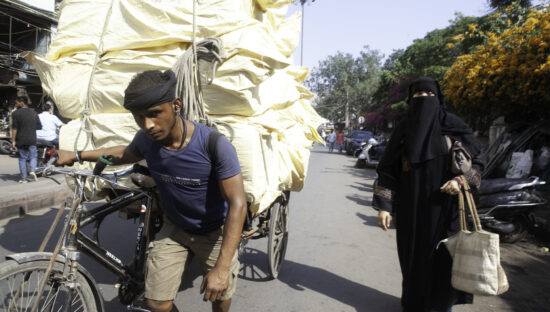 a worker in India dealing with extreme heat