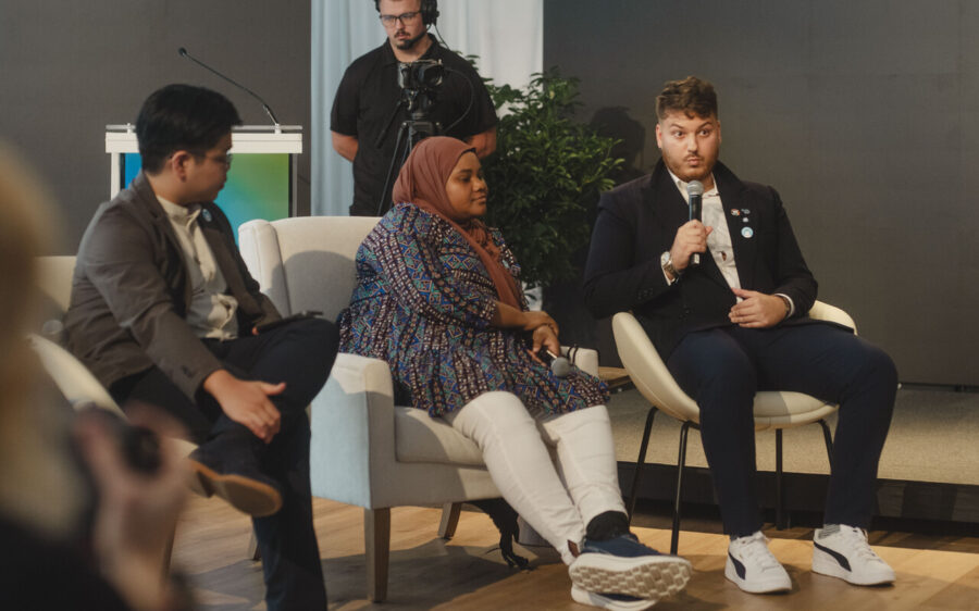 Max (with microphone) speaks during a panel at the UN General Assembly in New York. (courtesy photo)