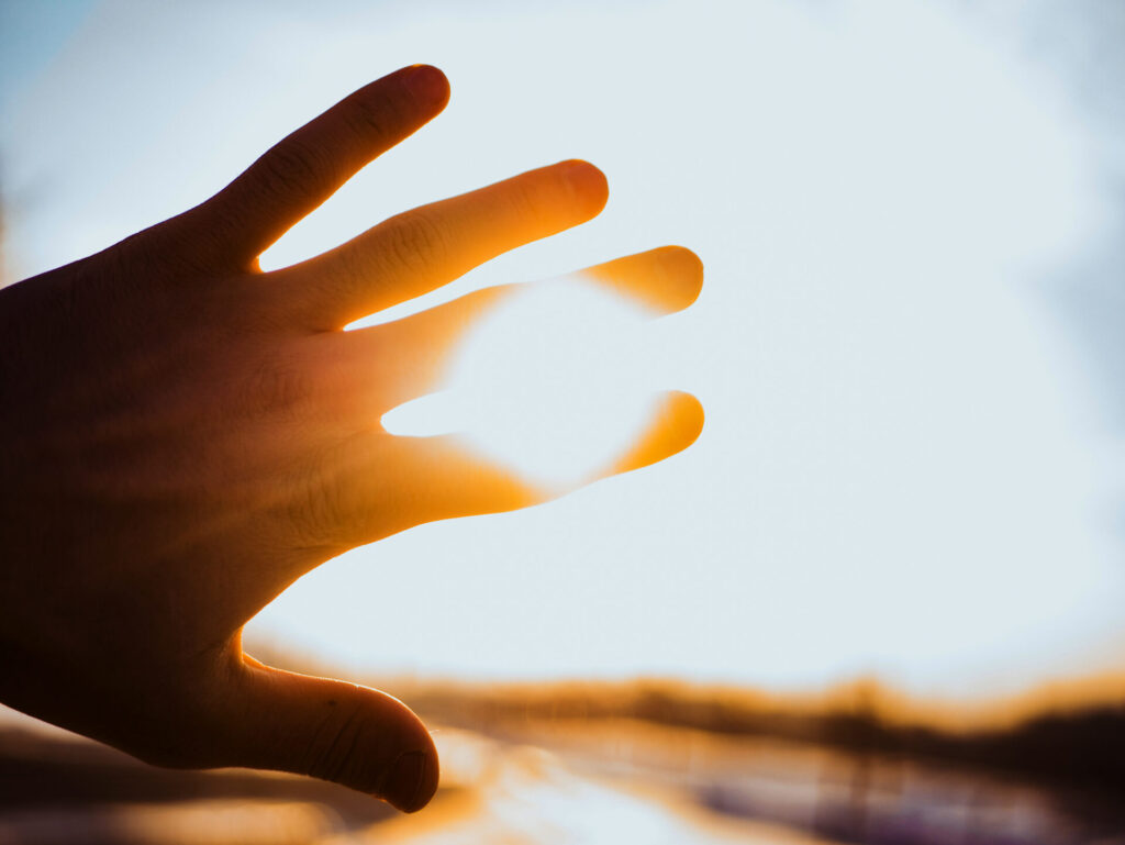 hand blocking sun