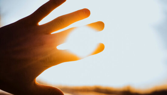 hand blocking sun