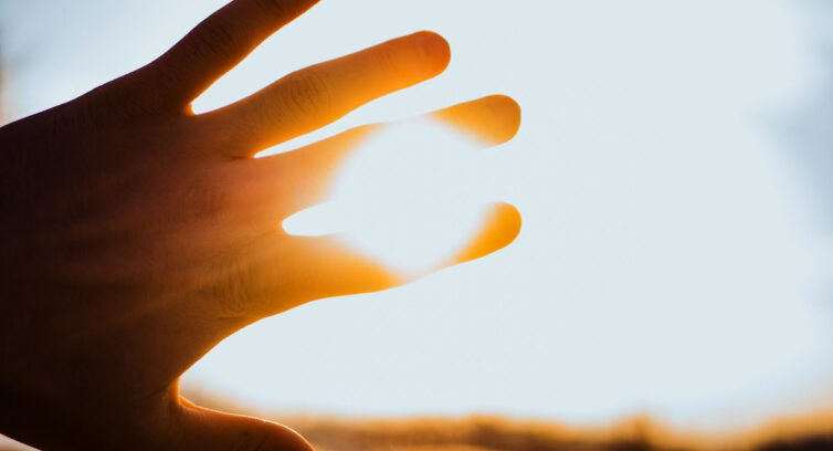 hand blocking sun