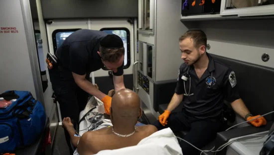 A man being treated in an ambulance