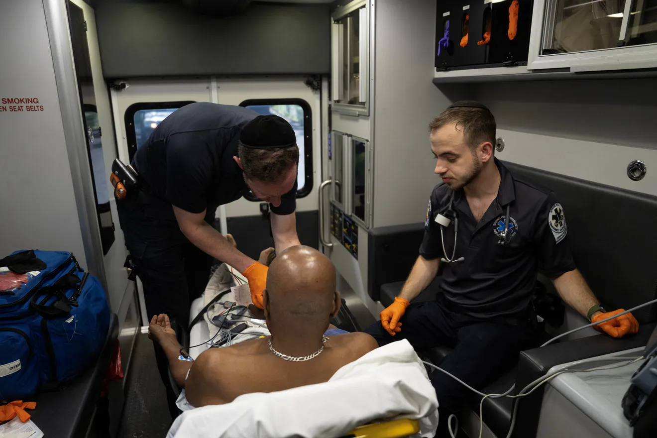 A man being treated in an ambulance